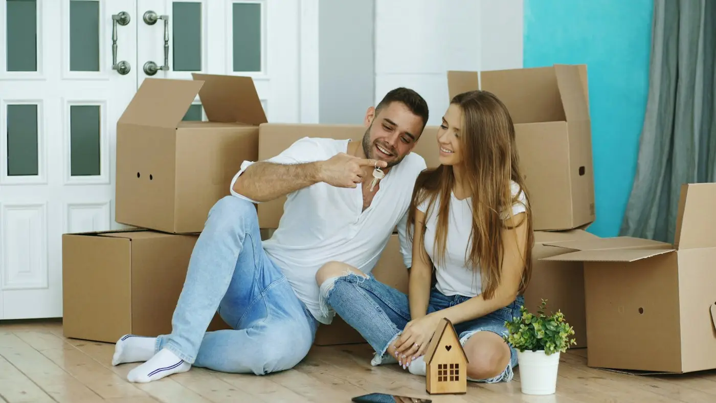 Couple among moving boxes