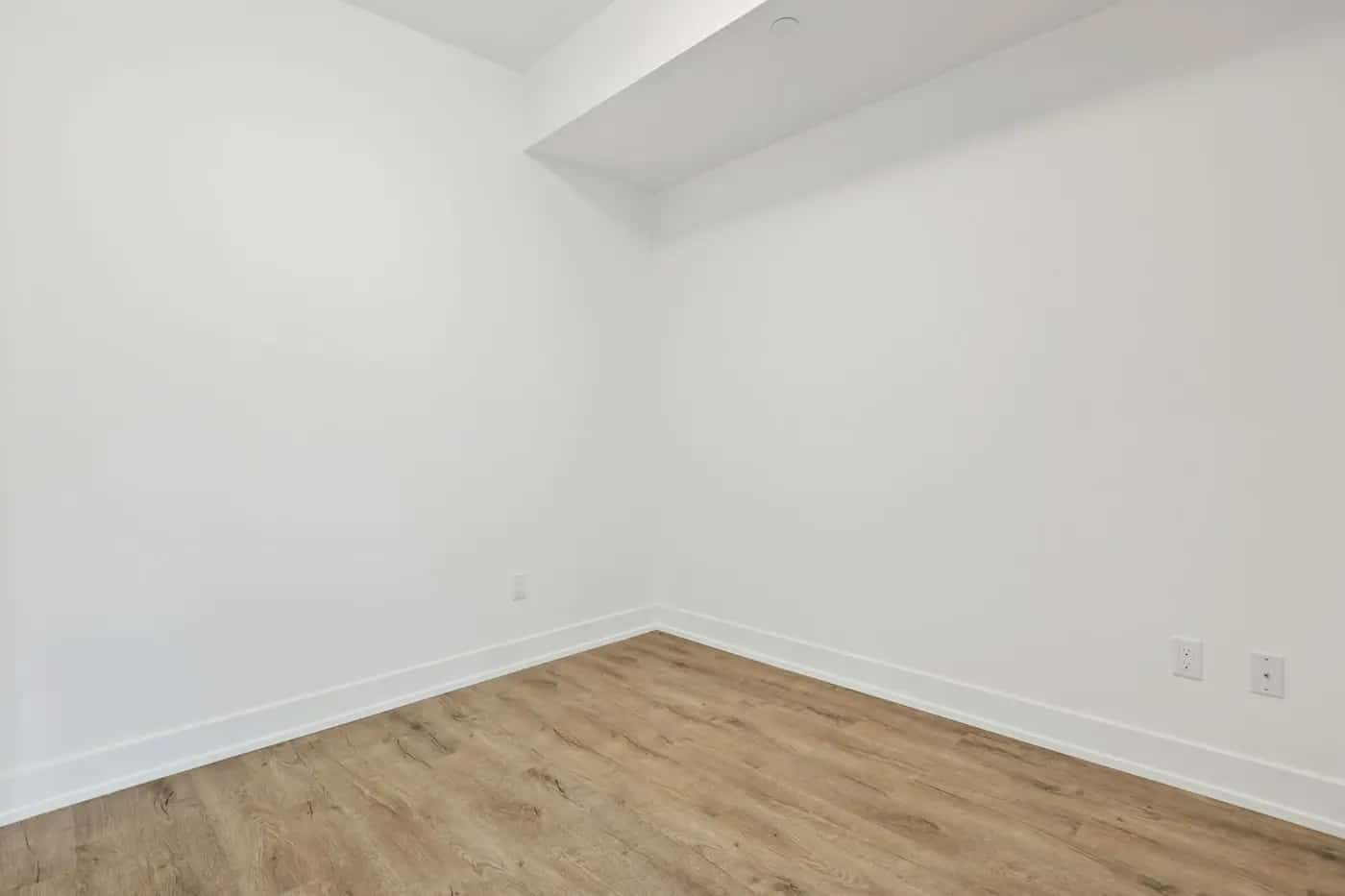 Empty room, white walls. wall-scuff.webp is the same photo with a scuff added programmatically (scripts/make-scuff.mjs) as an example.